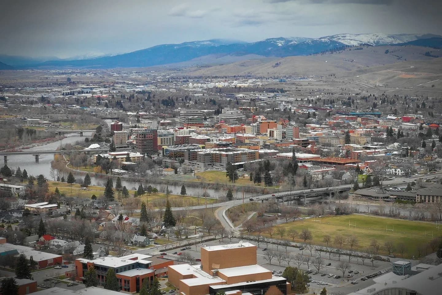 Car Service in Montana, MT Luxury travel Montana MT Car Service professional driver opening door for passenger