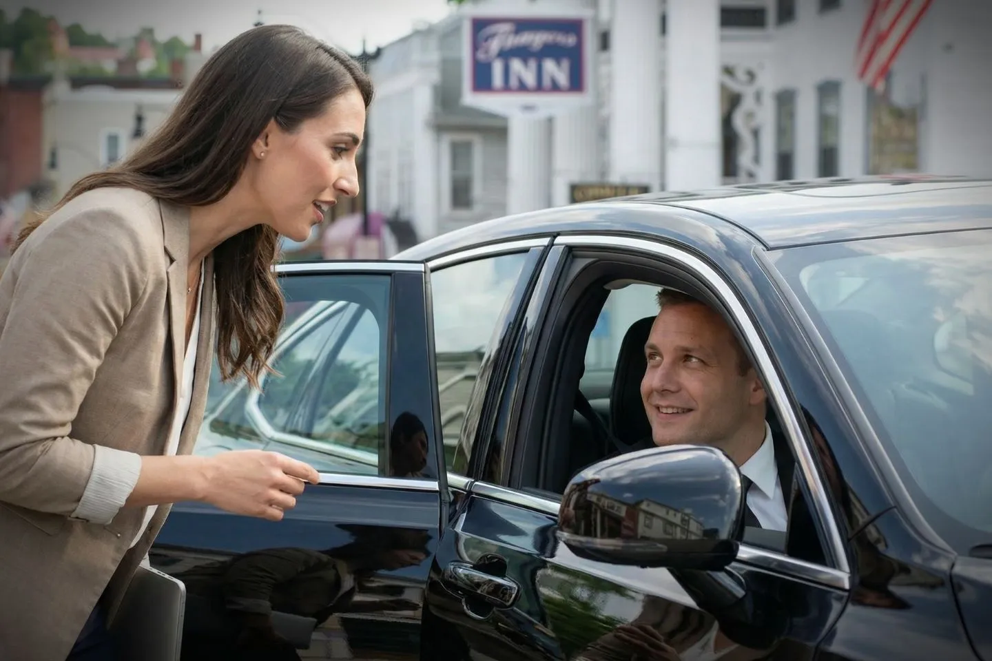 Chauffeur Service in New Hampshire, NH Black car arriving at hotel in New Hampshire NH Chauffeur Service professional driver assistance