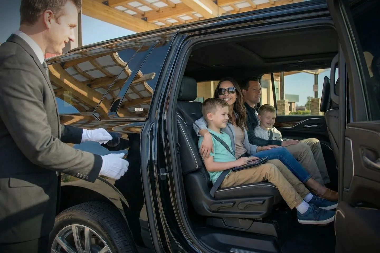 Airport Car Service in Nebraska, NE Luxury sedan providing Nebraska, NE Car Service for airport pickup in Omaha downtown skyline background