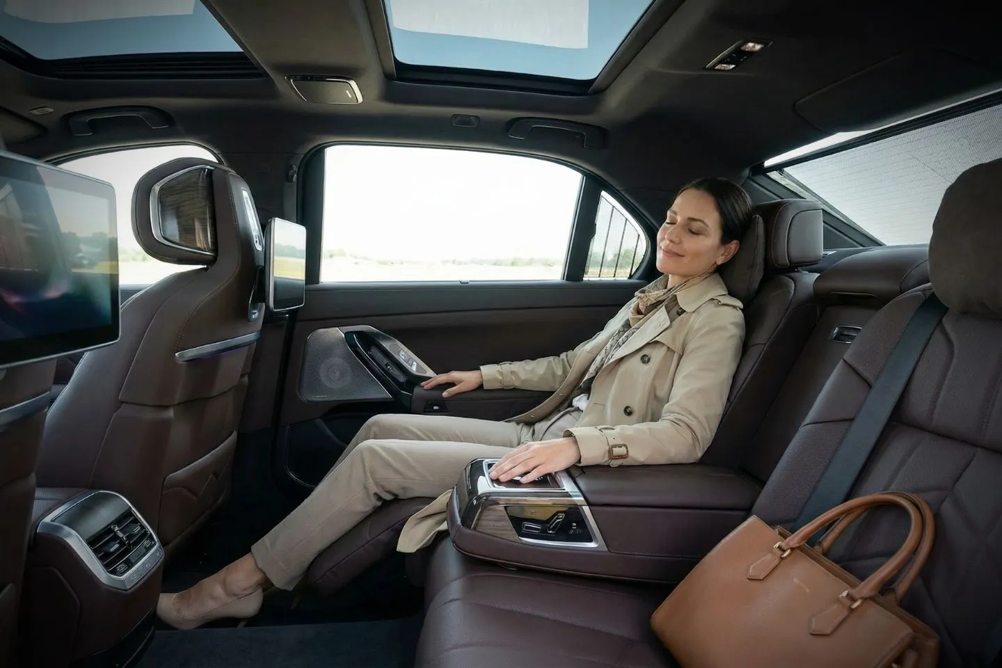 Airport Car Service in Tennessee, TN Professional chauffeur opening door for passenger using Tennessee, TN Car Service at hotel entrance