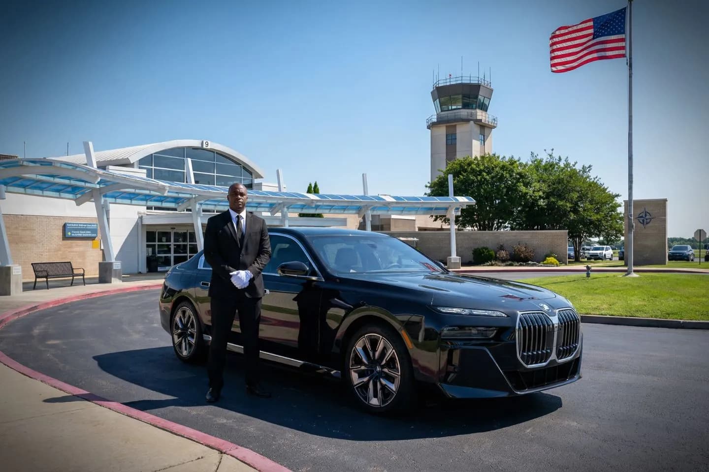 Airport Car Service in Tennessee, TN Chauffeur driven black car from Tennessee car service arriving at corporate office for executive pickup