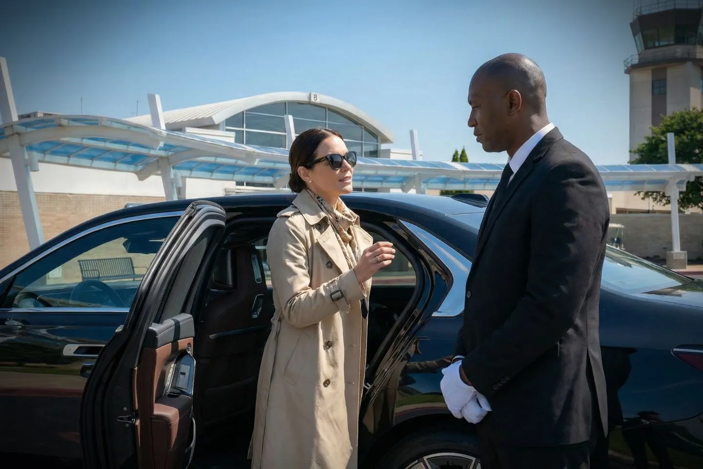 Airport Car Service in Tennessee, TN Executive SUV from Tennessee car service driving through downtown Nashville with client in back seat