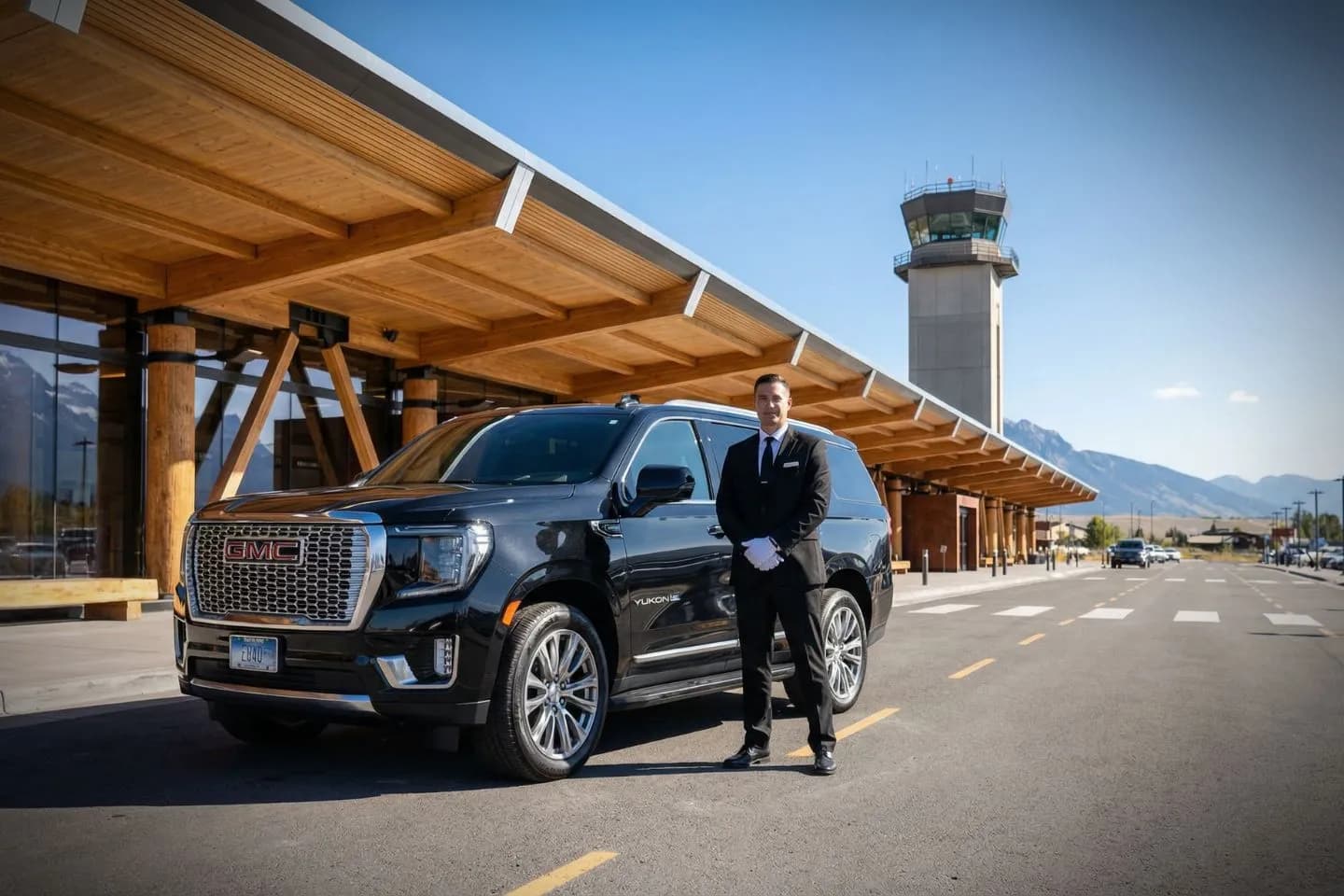 Airport Car Service in Wyoming, WY Wyoming, WY Car Service luxury sedan with professional chauffeur parked outside airport terminal