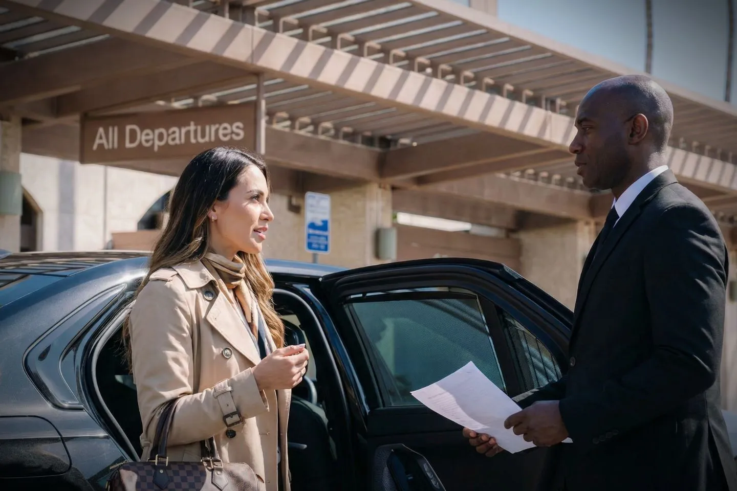 McAllen Miller International (MFE) Airport Car Service Professional chauffeur greeting client at MFE airport arrivals area