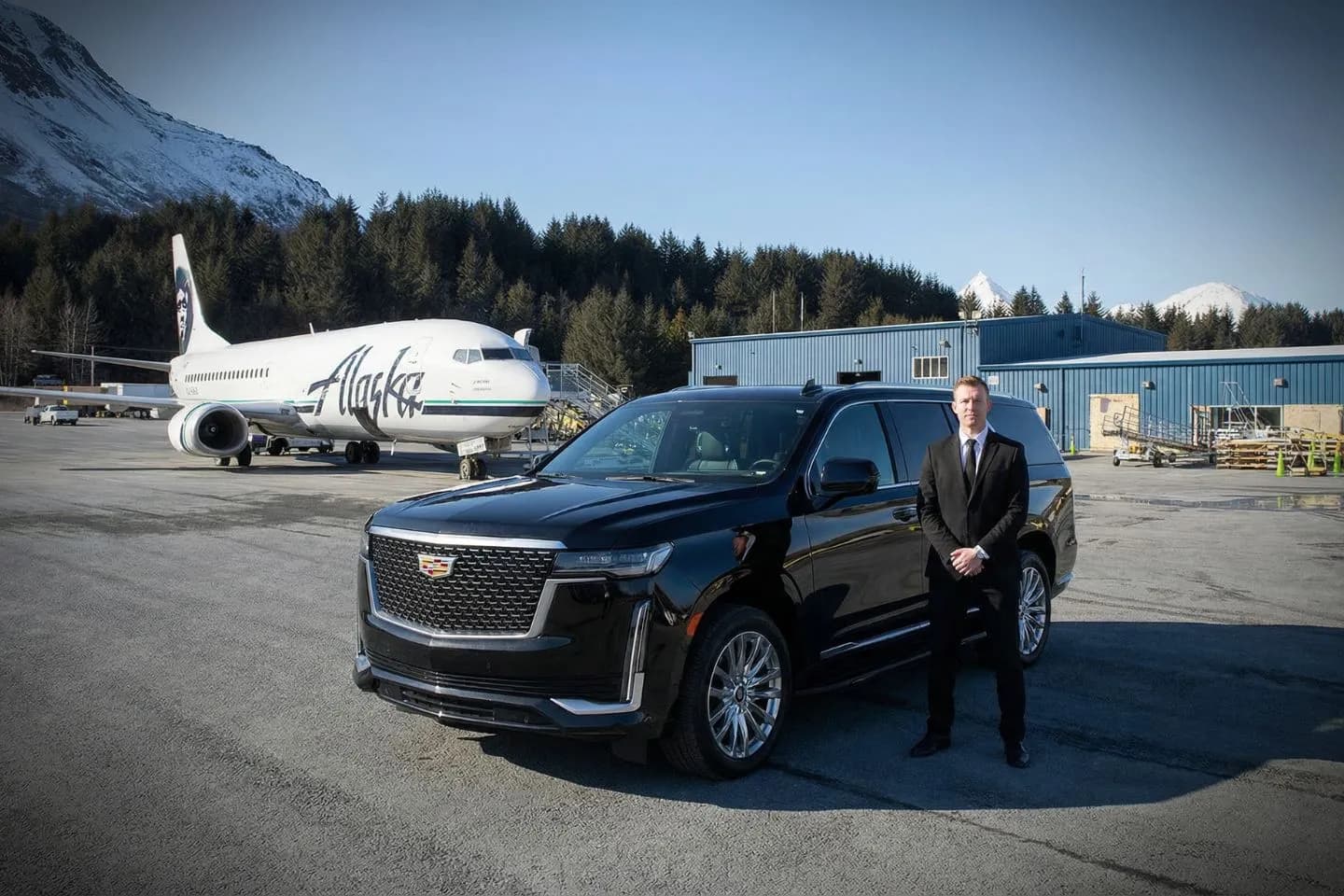 Kodiak Benny Benson State (ADQ) Airport Car Service Black luxury sedan parked at Kodiak Benny Benson State Airport terminal