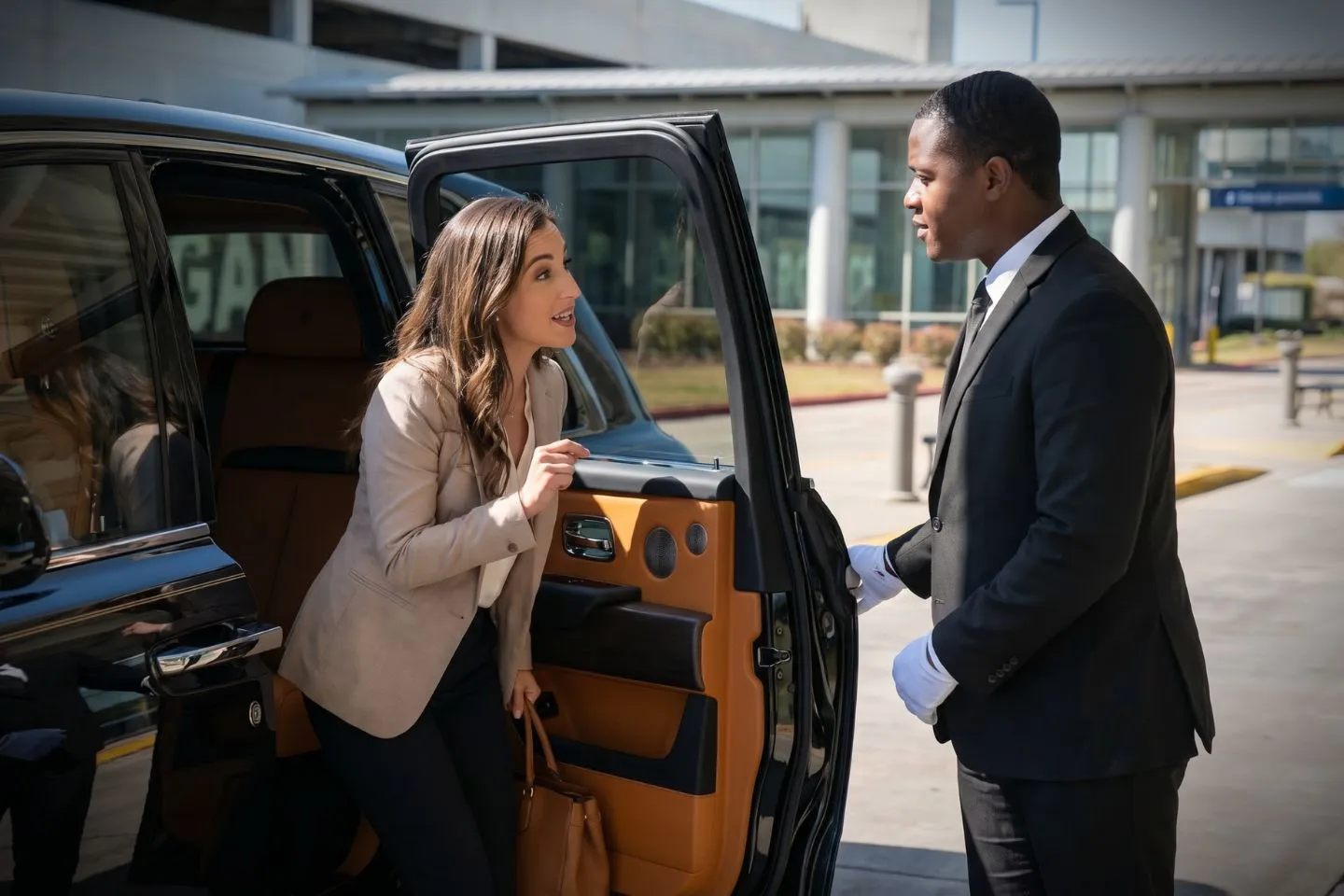 Baton Rouge Metropolitan (BTR) Airport Car Service Professional chauffeur greeting passenger at BTR baggage claim arrivals area