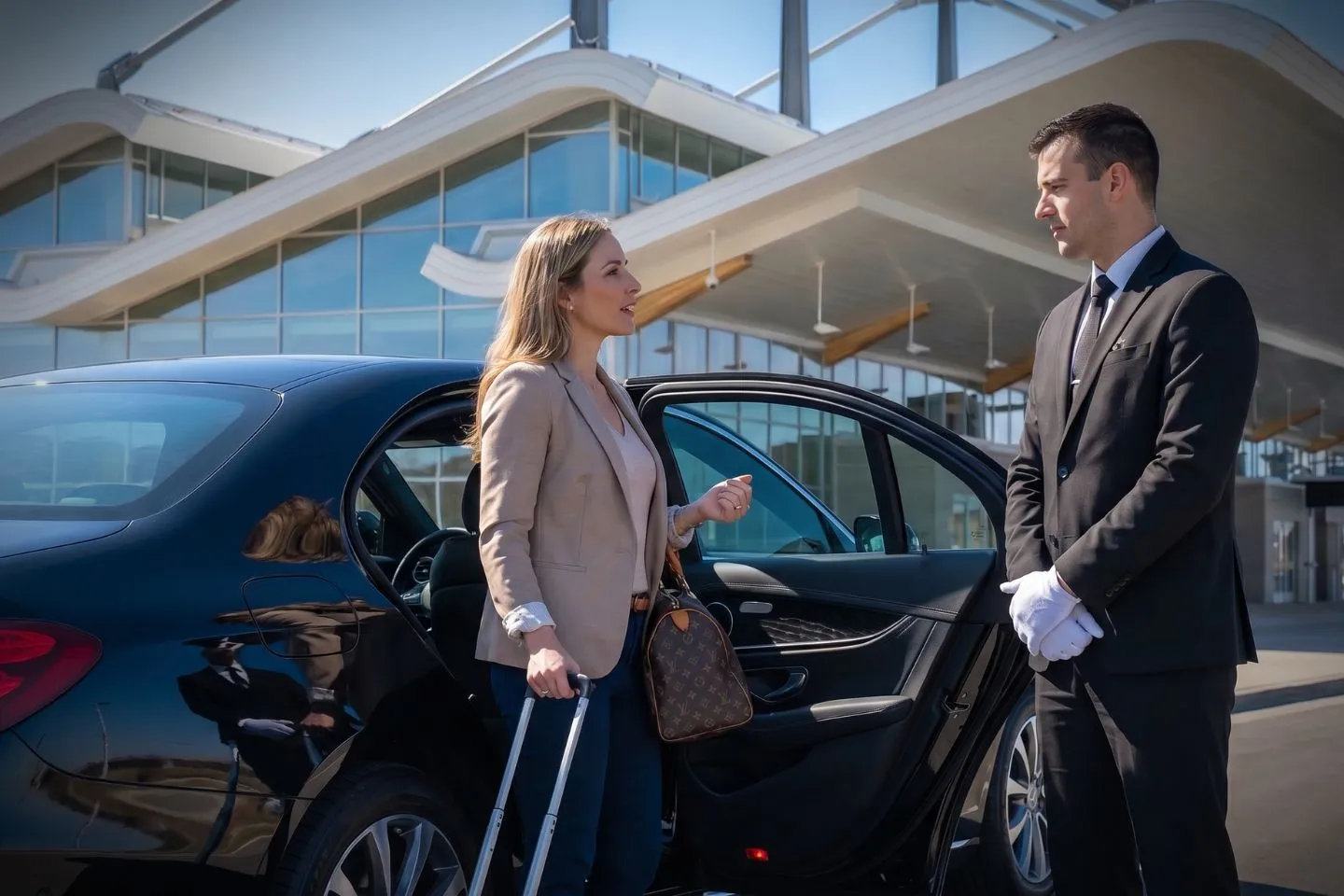 MBS International (MBS) Airport Car Service Union Limousine chauffeur greeting Dow executive at MBS Midland Bay City Saginaw International airport baggage claim