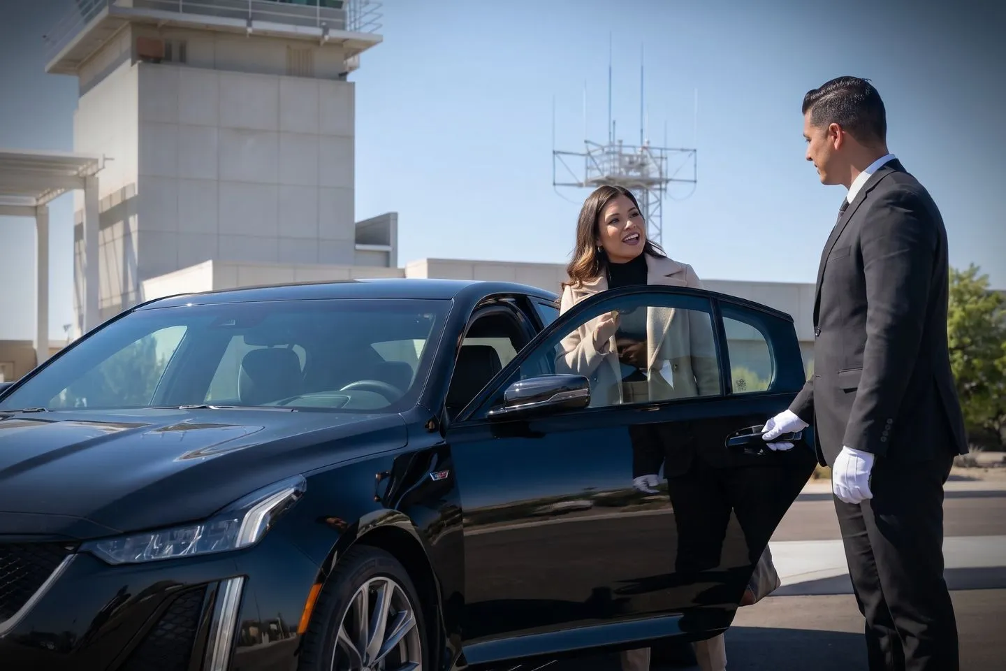 Lea County Regional (HOB) Airport Car Service Professional chauffeur greeting passenger at HOB baggage claim arrivals area
