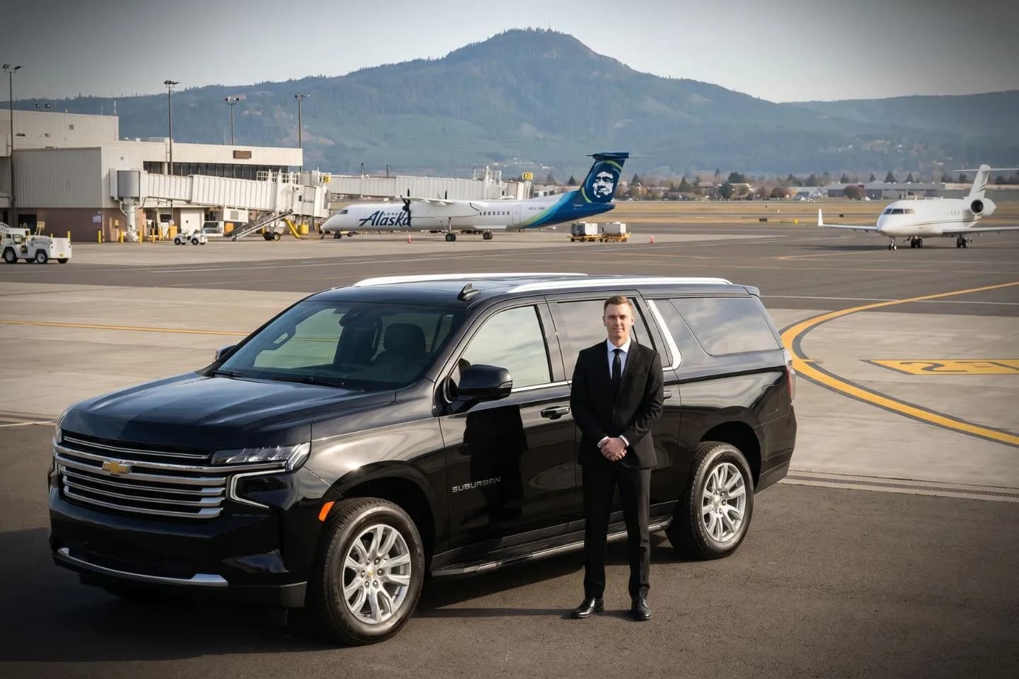 Rogue Valley International Medford (MFR) Airport Car Service Black Cadillac Escalade chauffeured car at Rogue Valley International airport for ride to Harry and David and Bear Creek Corporation