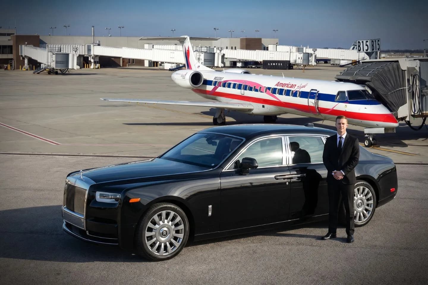 Dayton International (DAY) Airport Car Service Black luxury sedan parked at Dayton International Airport terminal curbside in Ohio
