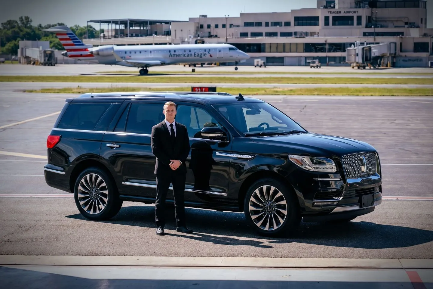 West Virginia International Yeager (CRW) Airport Car Service Black luxury sedan parked at West Virginia International Yeager Airport terminal curbside