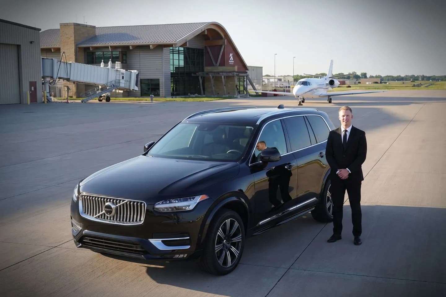 Appleton International (ATW) Airport Car Service Black luxury sedan parked at Appleton International Airport terminal curbside in Wisconsin