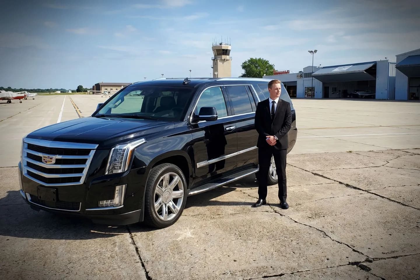 Aurora Municipal (ARR) Airport Car Service Black Cadillac Escalade chauffeured car at Aurora Municipal airport for ride to DuPage and Kane County business destinations