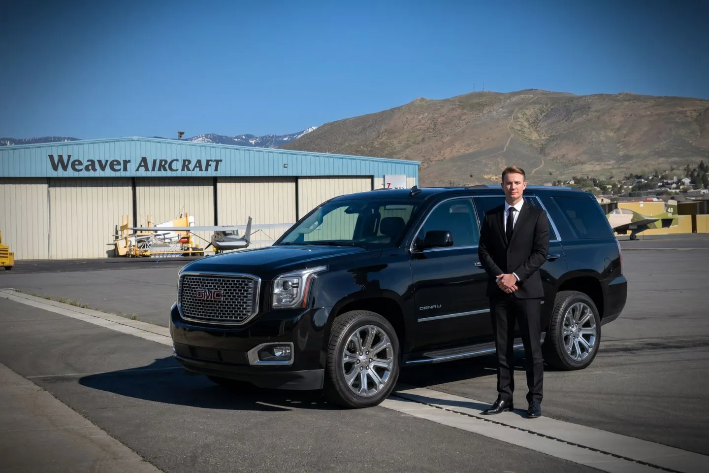 Carson City (CXP) Airport Car Service Black Cadillac Escalade chauffeured car at Carson City Airport for ride to Virginia City and the historic Comstock Lode mining district