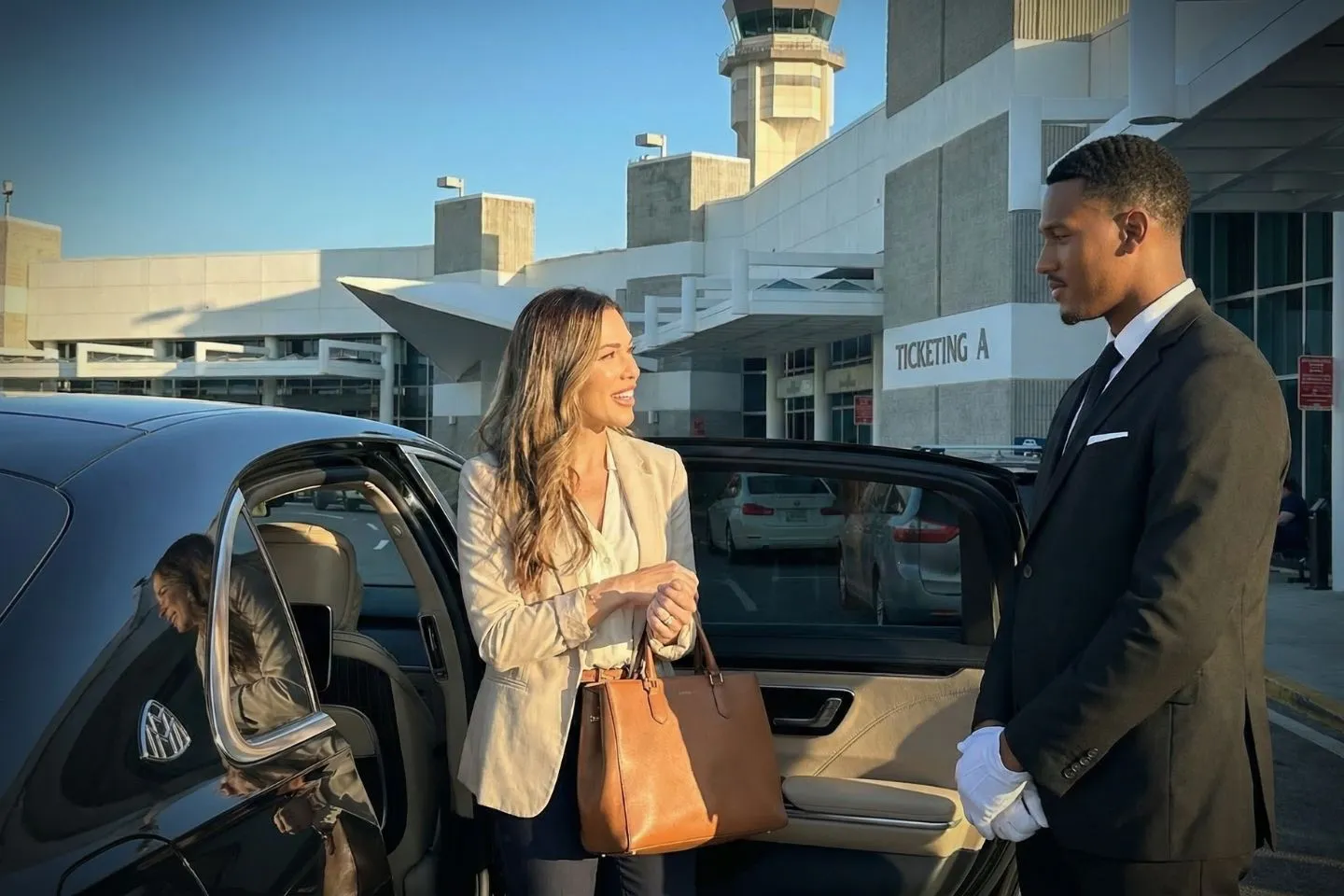 Palm Beach County Park/Lantana (LNA) Airport Car Service Professional chauffeur greeting passenger at LNA FBO lobby private aviation arrivals