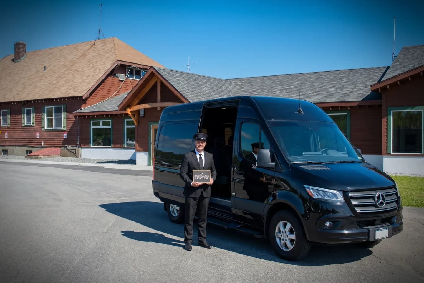 Adirondack Regional (SLK) Airport Sprinter Van Rental Black Sprinter van rental outside the Adirondack Regional Airport terminal