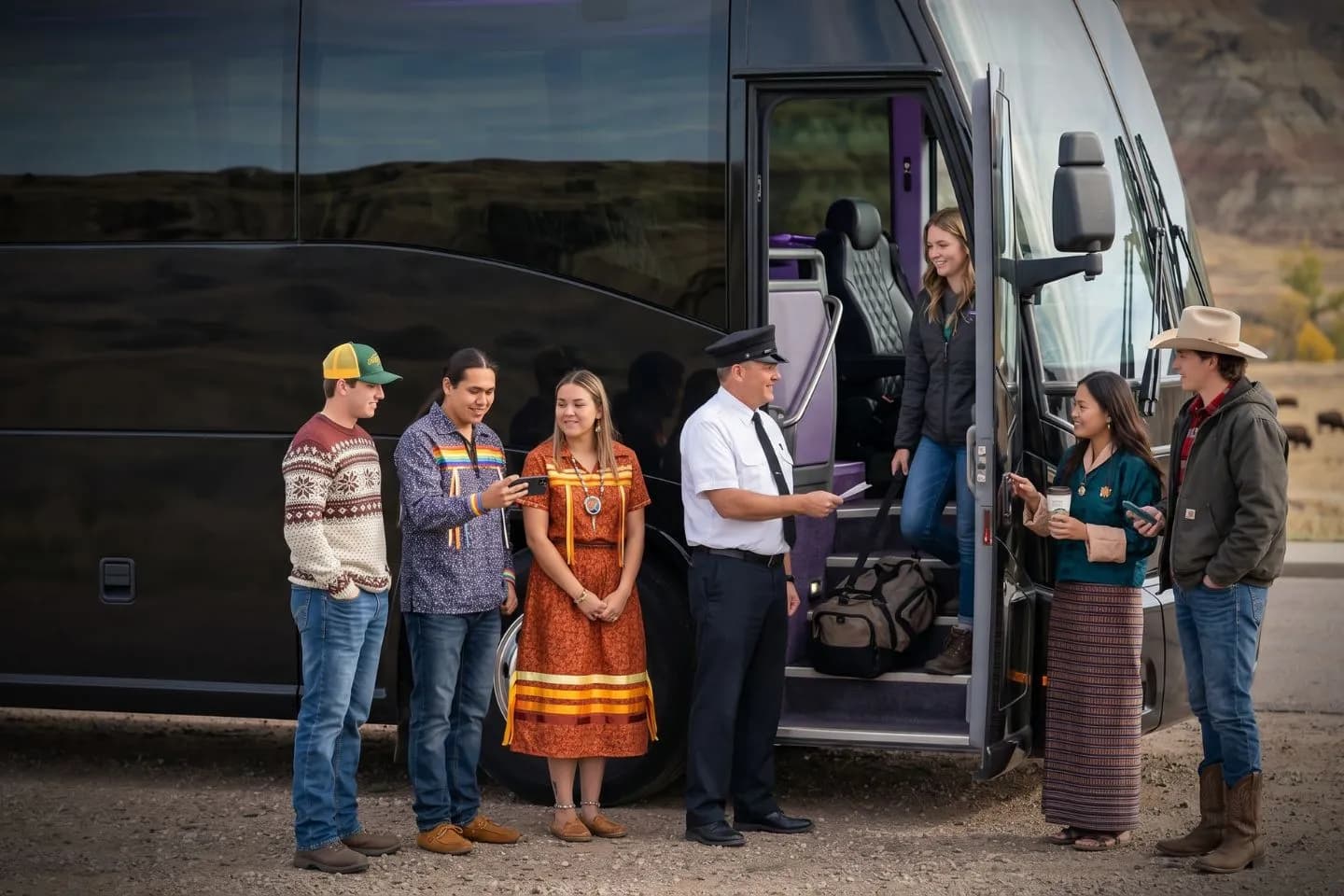 North Dakota Charter Bus Rental Service Professional driver welcoming guests aboard a luxury charter bus in North Dakota