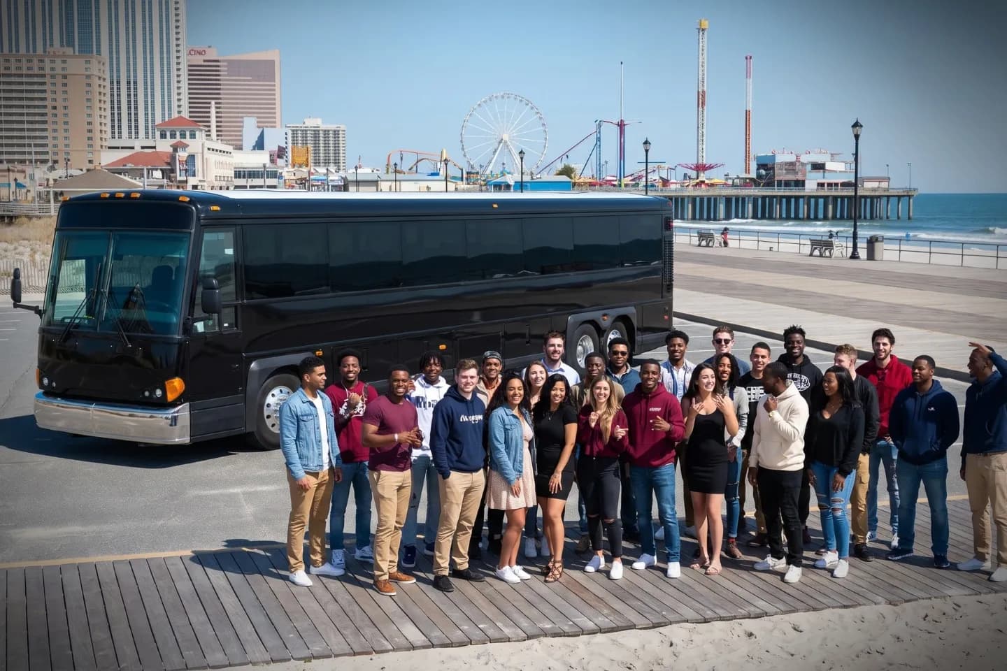 New Jersey Charter Bus Rental Service Black charter bus waiting outside a Newark hotel for a New Jersey corporate group