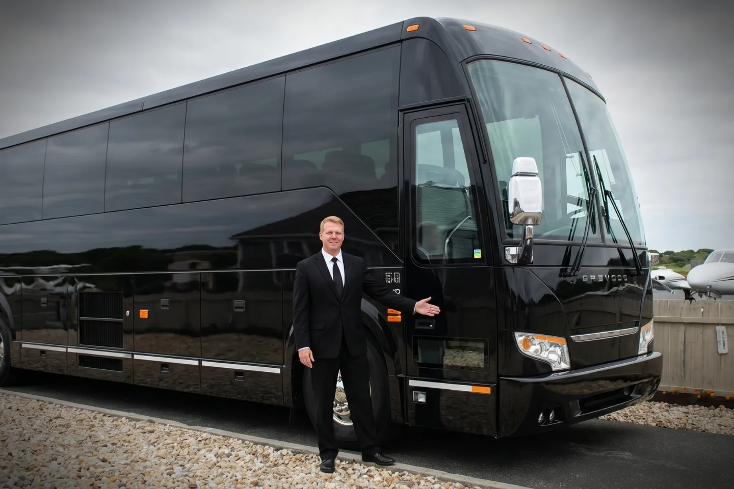 Montauk Suffolk County (MTP) Airport Charter Bus Rental Service Driver loading beach bags into a charter bus at Montauk Suffolk County Airport