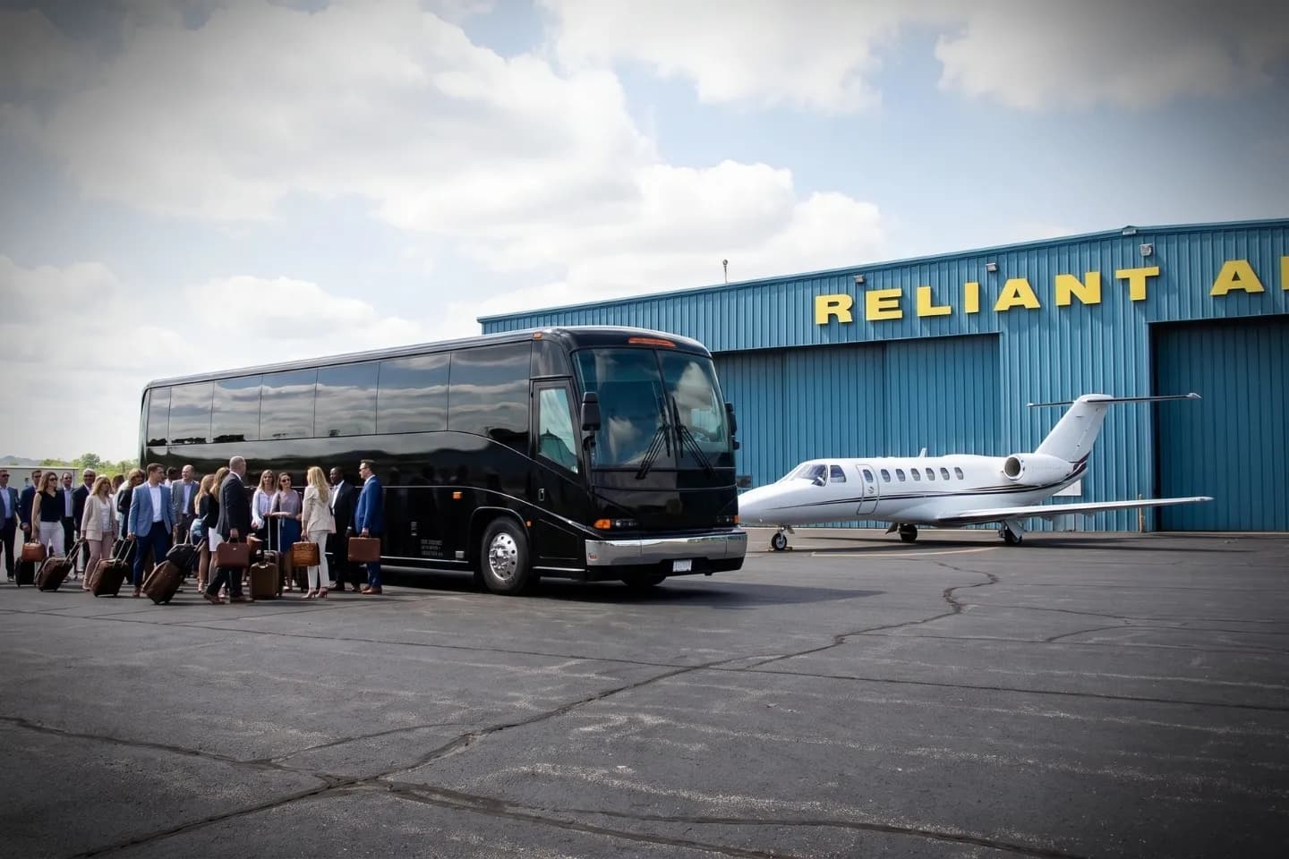 Danbury Municipal (DXR) Airport Charter Bus Rental Service Charter bus rental parked outside the Danbury Municipal Airport DXR terminal