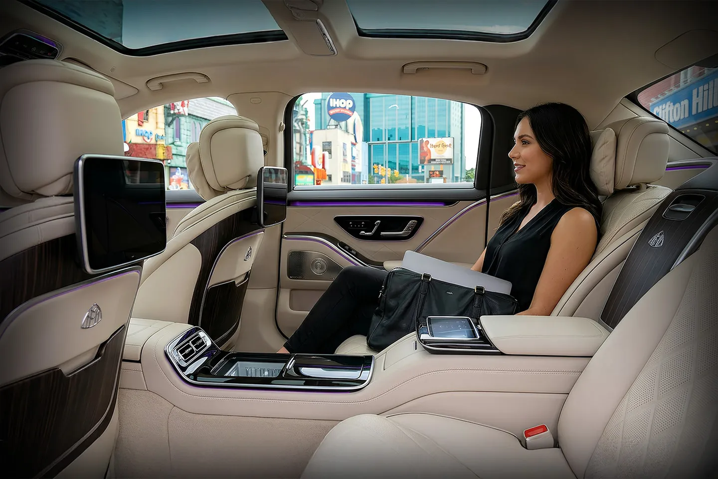 Black executive car on city street offering Niagara, NY Chauffeur Service for corporate and private travel in Niagara region