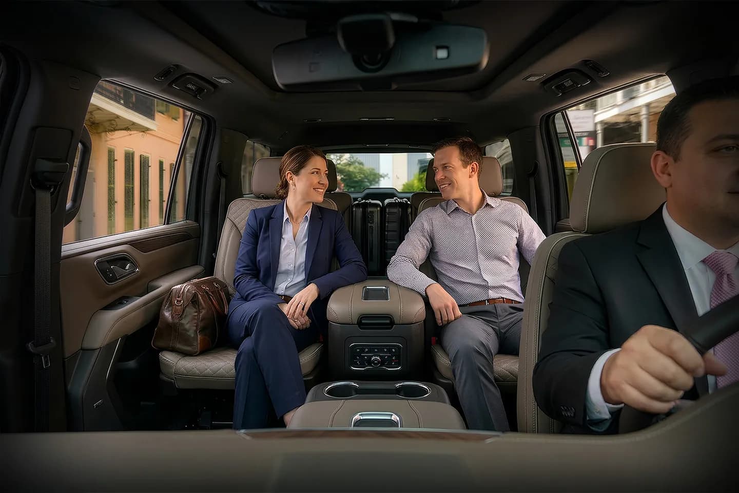 Business traveler riding in Orleans NY chauffeur service vehicle with professional driver