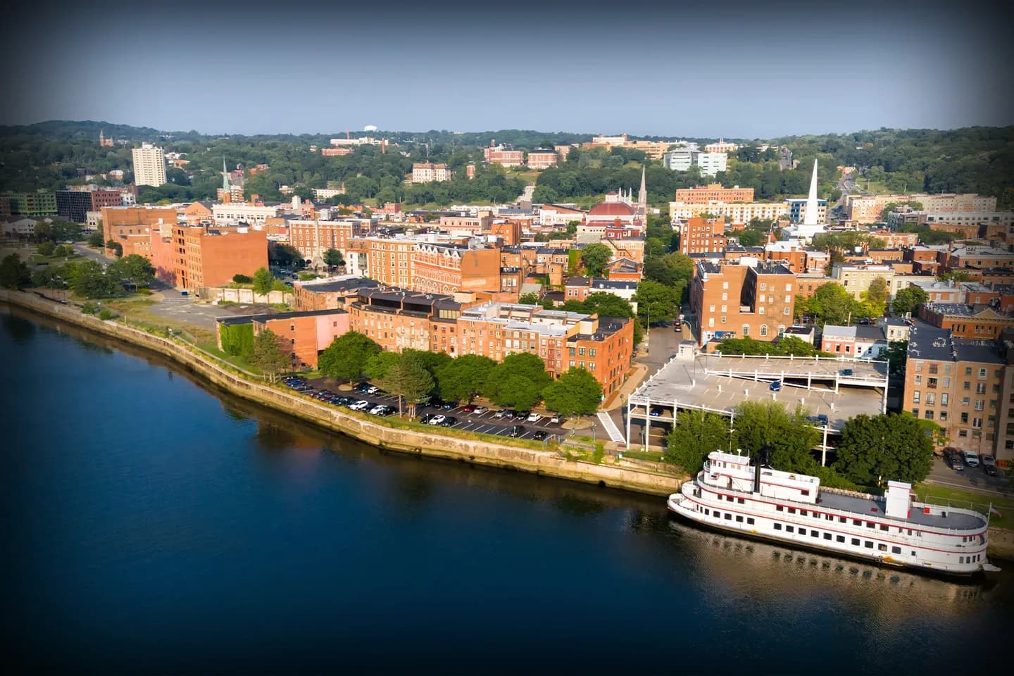 Rensselaer, NY Chauffeur Service luxury sedan waiting outside downtown hotel for passenger pickup