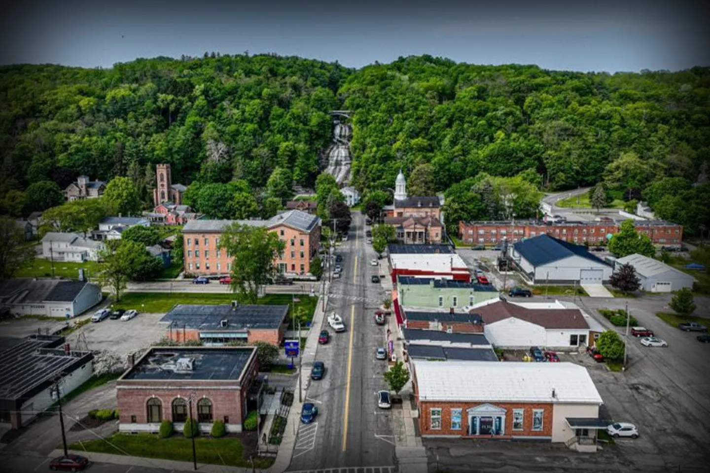 Schuyler, NY Chauffeur Service luxury sedan parked outside upscale home with professional driver