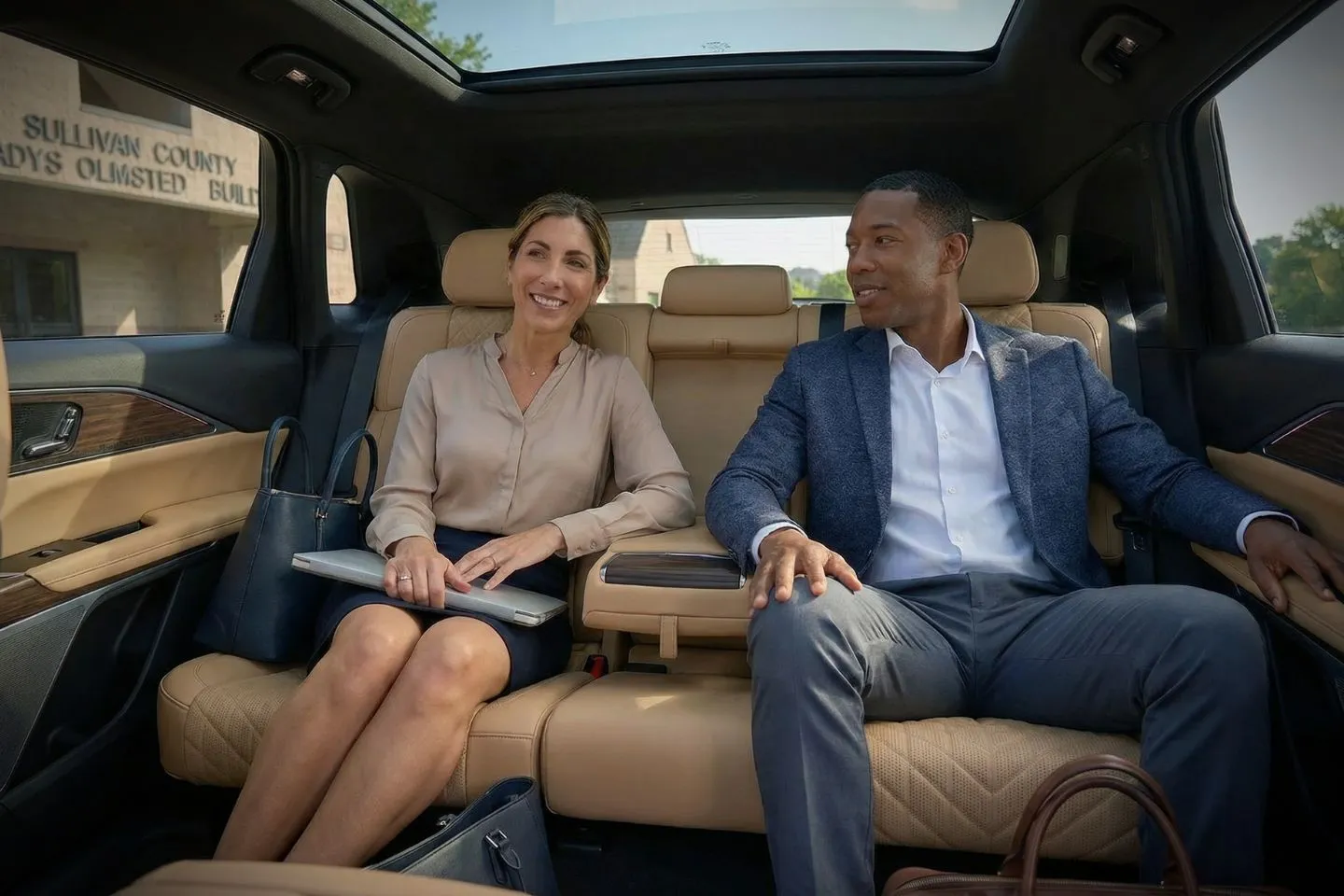 Luxury sedan from Sullivan, NY Chauffeur Service parked outside a corporate office ready for executive pickup