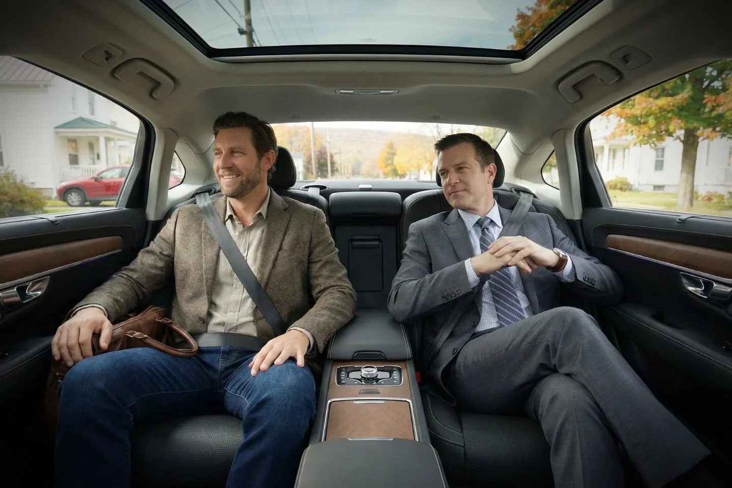 Professional chauffeur opening car door for passenger in Tompkins NY highlighting Tompkins, NY Chauffeur Service reliability