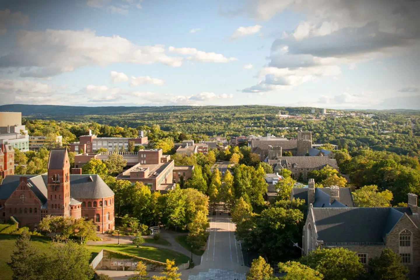 Airport pickup scene in Tompkins NY with chauffeur holding sign for Tompkins, NY Chauffeur Service arriving passengers