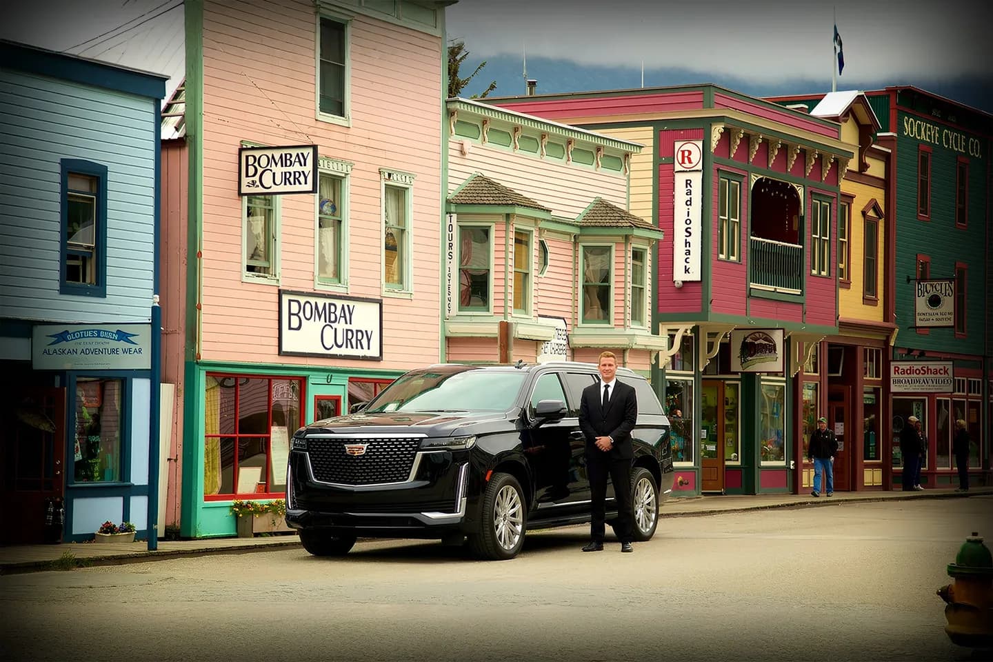 Alaska, AK Car Service chauffeur driven vehicle waiting outside hotel offering reliable transportation in Alaska cities