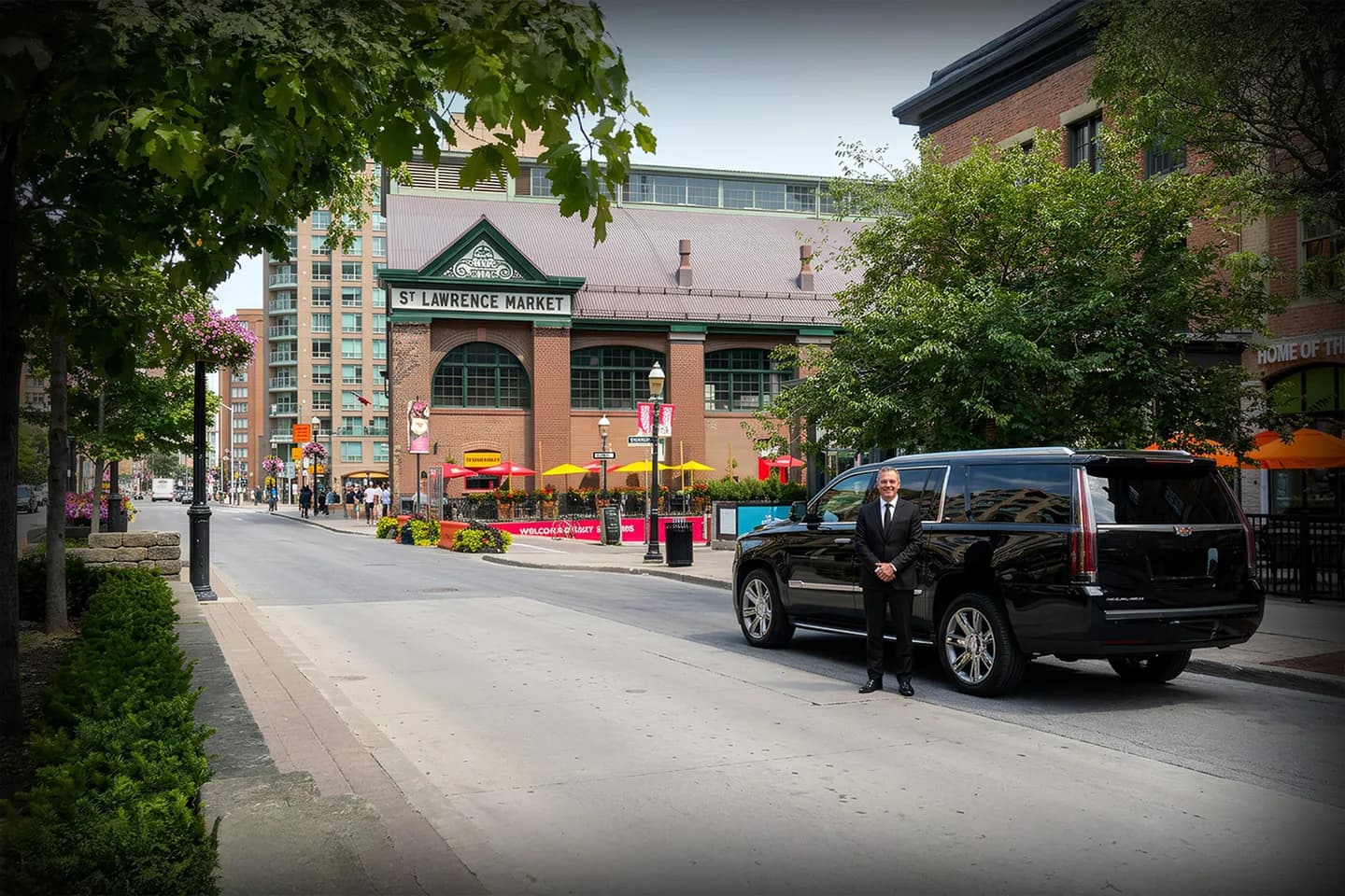 Chauffeur Service in Saint Lawrence, NY Professional chauffeur assisting passenger with luggage for Saint Lawrence NY Chauffeur Service ride